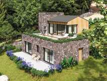 Forest Home Cottages auf São Miguel: Modernes Natursteinhaus mit begrüntem Dach und Sonnenterrasse mitten im Grünen