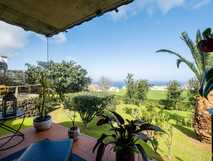 Tradicampo - Casa da Talha auf Sao Miguel, entspannte Gartenterrasse mit Meerblick für erholsame Urlaubsmomente bei picotours.