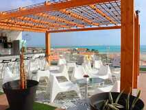 Hotel Ouril Agueda auf Boa Vista, stilvolle Dachterrasse mit Lounge-Bereich und Meerblick – perfekter Ort zum Entspannen und Genießen.