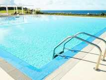 ANC Experience Resort auf Sao Miguel, einladender Außenpool mit traumhaftem Meerblick für entspannte Urlaubsmomente.